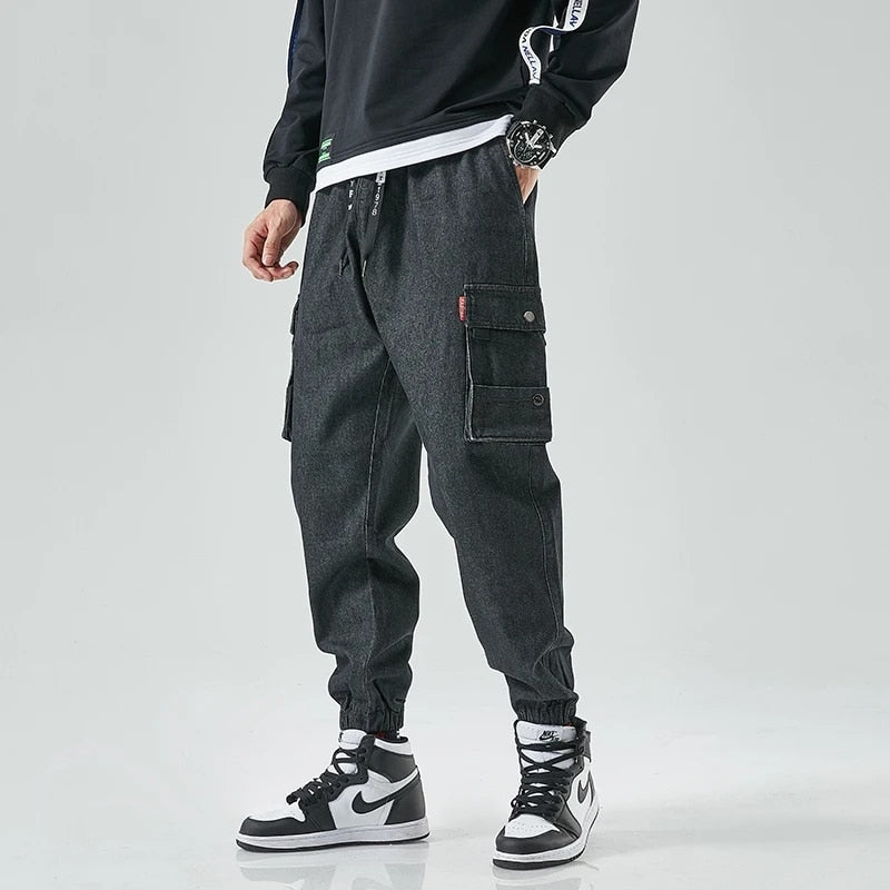Dark wash heavyweight denim cargo joggers tapered fit with dual snap cargo pockets for active men