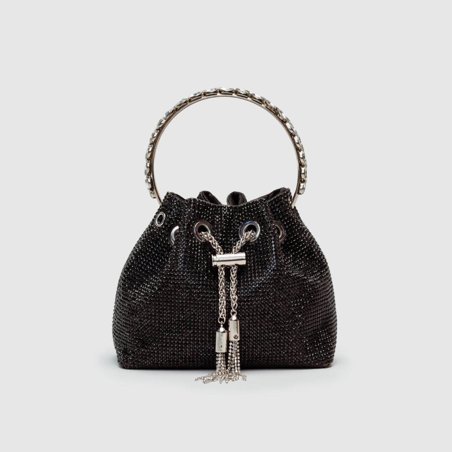 Rhinestone-embellished silver bucket bag with chain crossbody strap, glamorous evening statement piece
