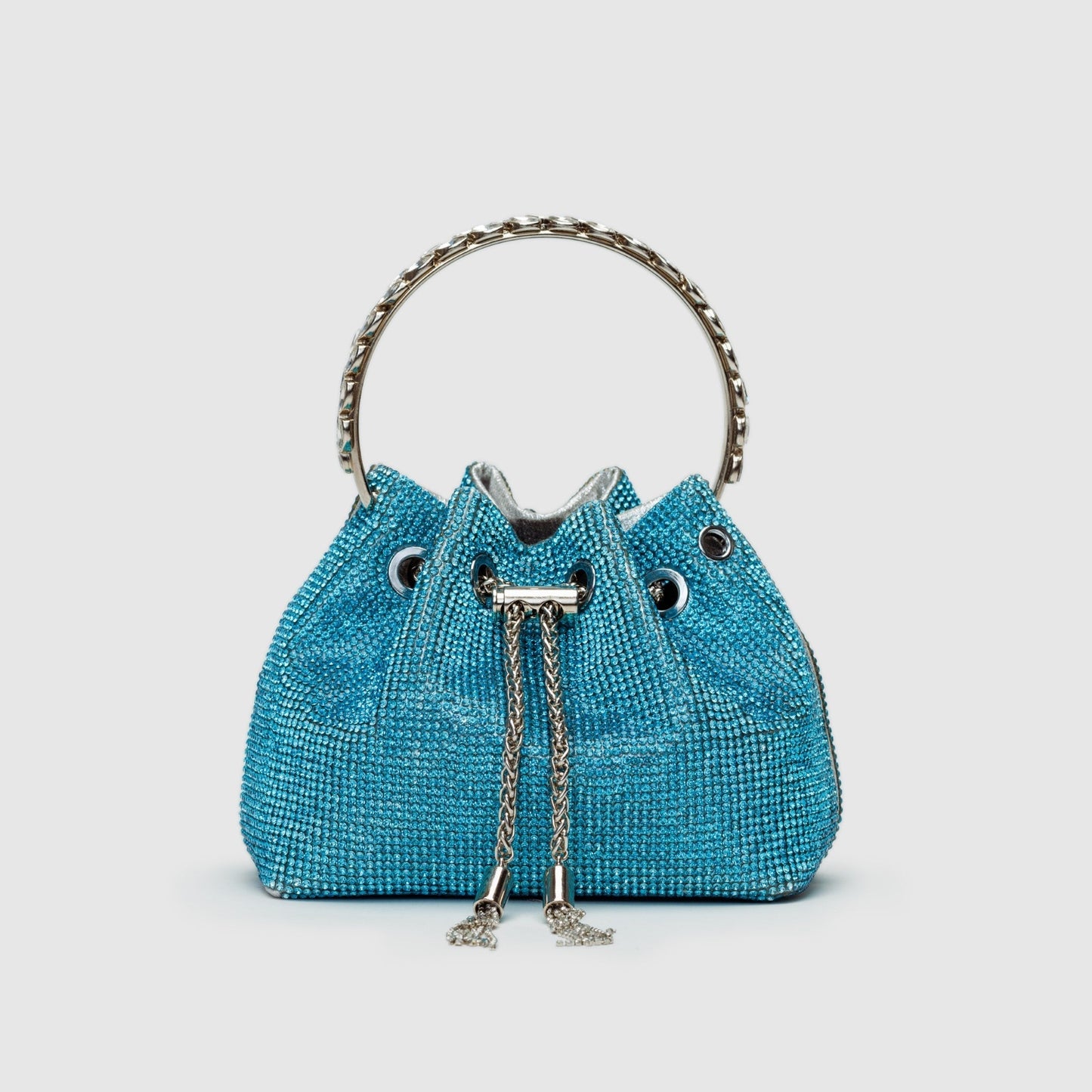 Rhinestone-embellished silver bucket bag with chain crossbody strap, glamorous evening fashion statement