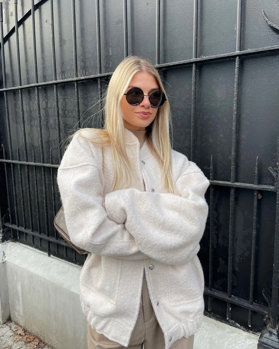 Women's oversized bomber jacket neutral tone relaxed fit with ribbed cuffs spring layering essential