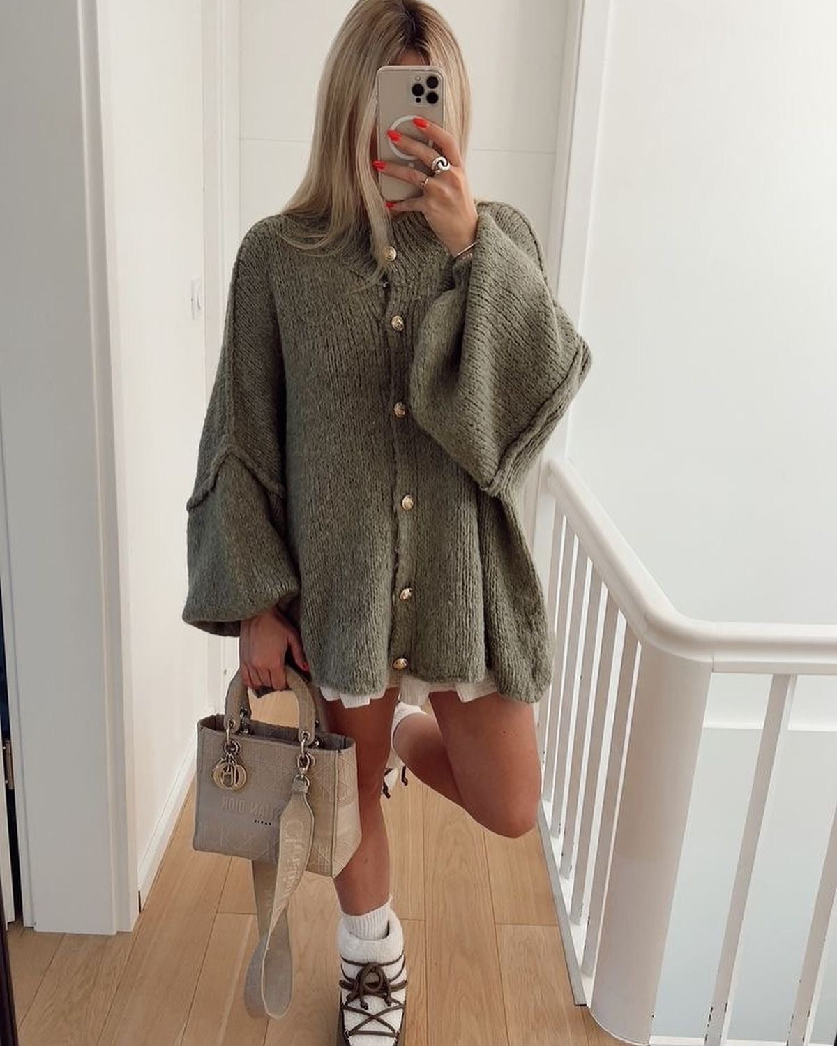 Women's oversized wool cardigan in neutral tone, relaxed fit with minimalist design and cozy soft drape
