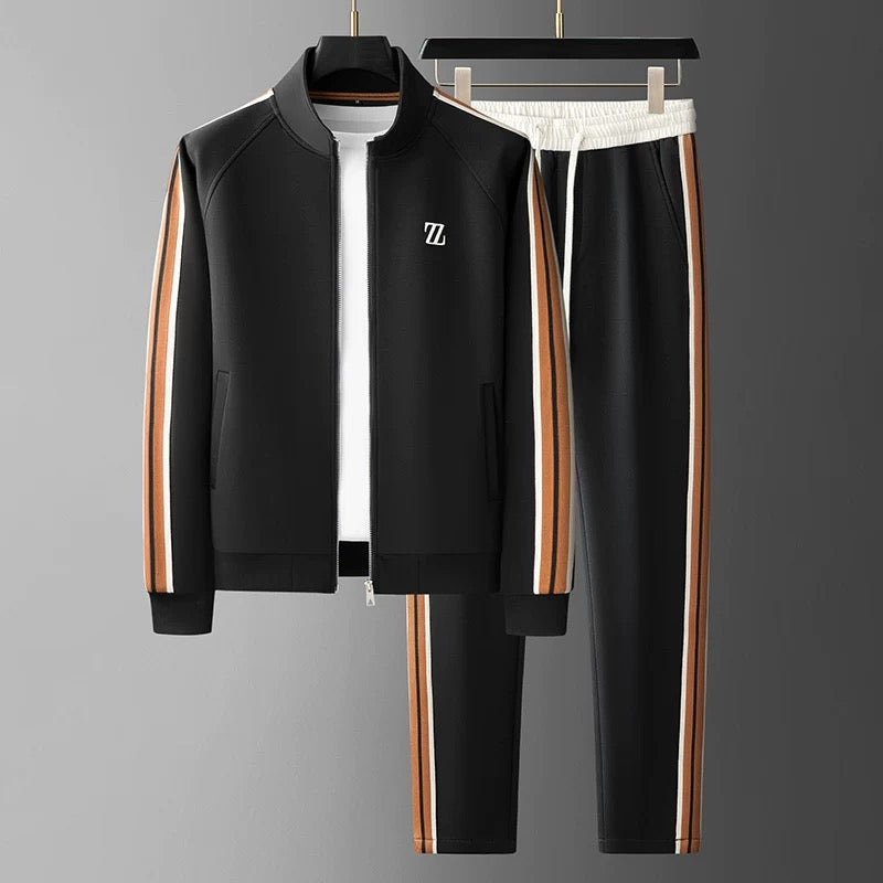 Men's gray streetwear jogging suit set with sleek side stripes, zip-up jacket, and tapered jogger pants
