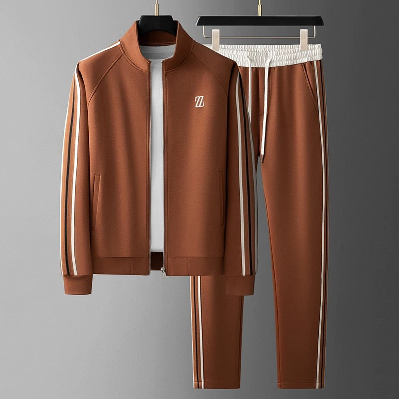 Men's two-piece streetwear jogging suit set with sleek side stripes and tapered fit zip-up jacket