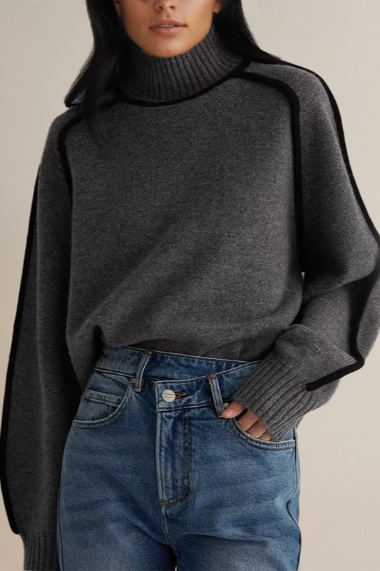 Women's relaxed knit turtleneck sweater with ribbed detailing and contrast piping trim