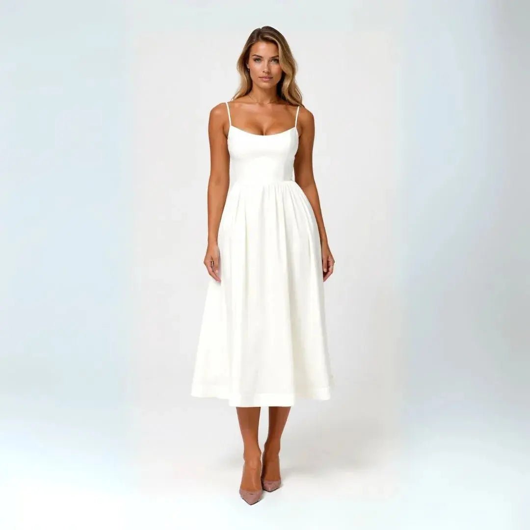 Flowy fit-and-flare midi dress with spaghetti straps, sweetheart neckline, and romantic feminine silhouette