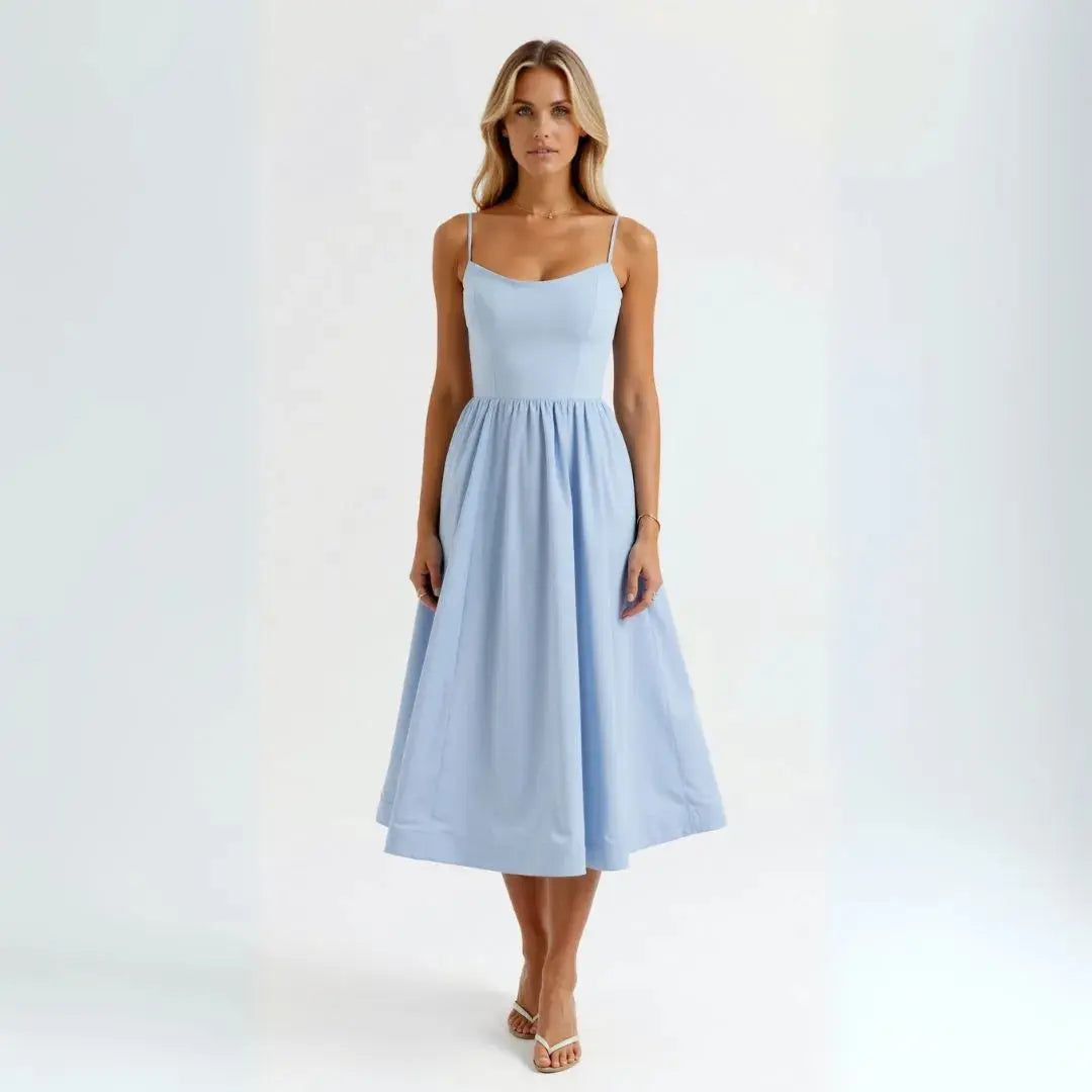 Flowy fit-and-flare midi dress with spaghetti straps, sweetheart neckline, and full romantic skirt