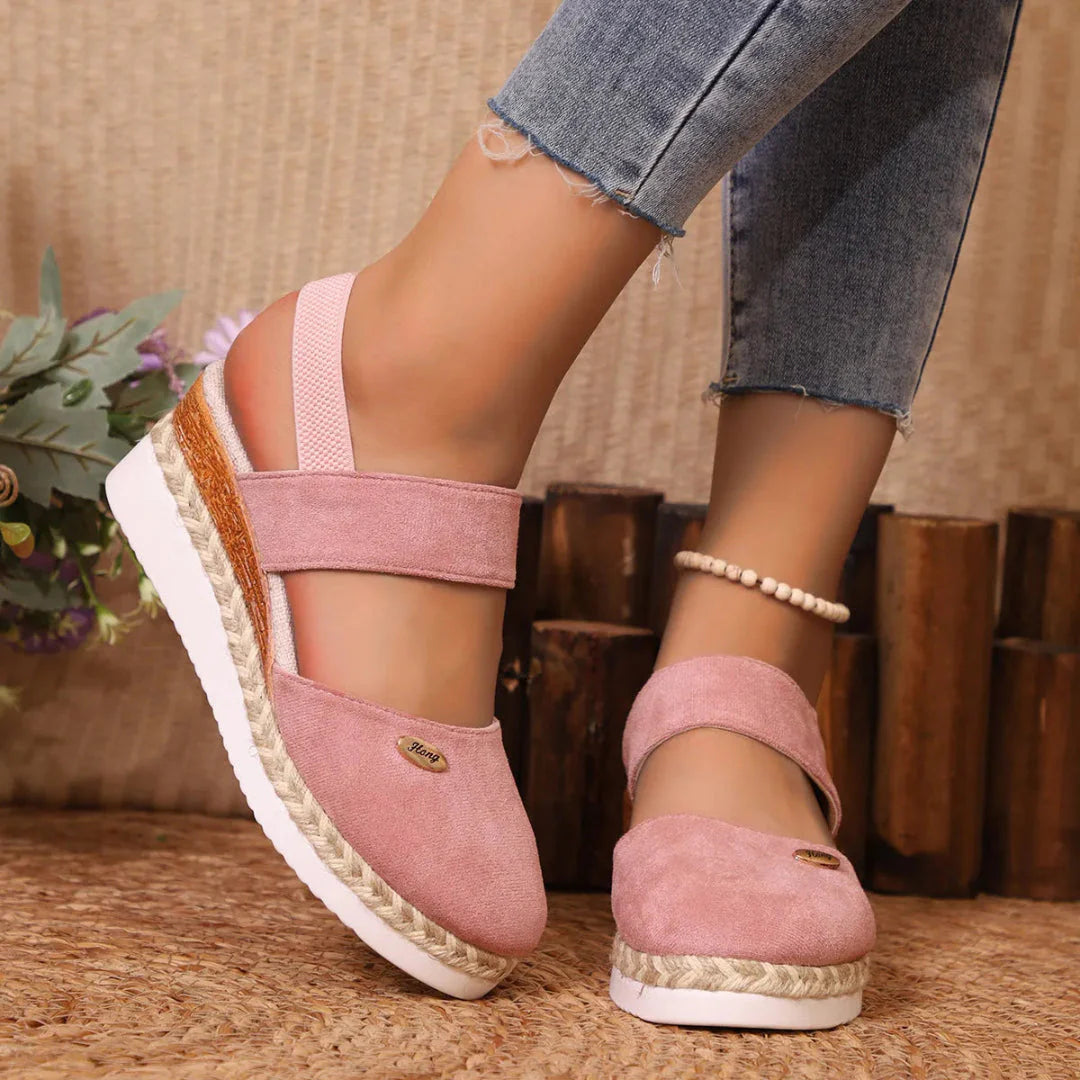 Women's beige closed-toe suede wedge sandals with jute-wrapped espadrille sole and supportive straps