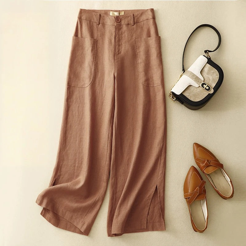 Ivory wide-leg linen trousers high-rise cropped silhouette with front pockets and side slits
