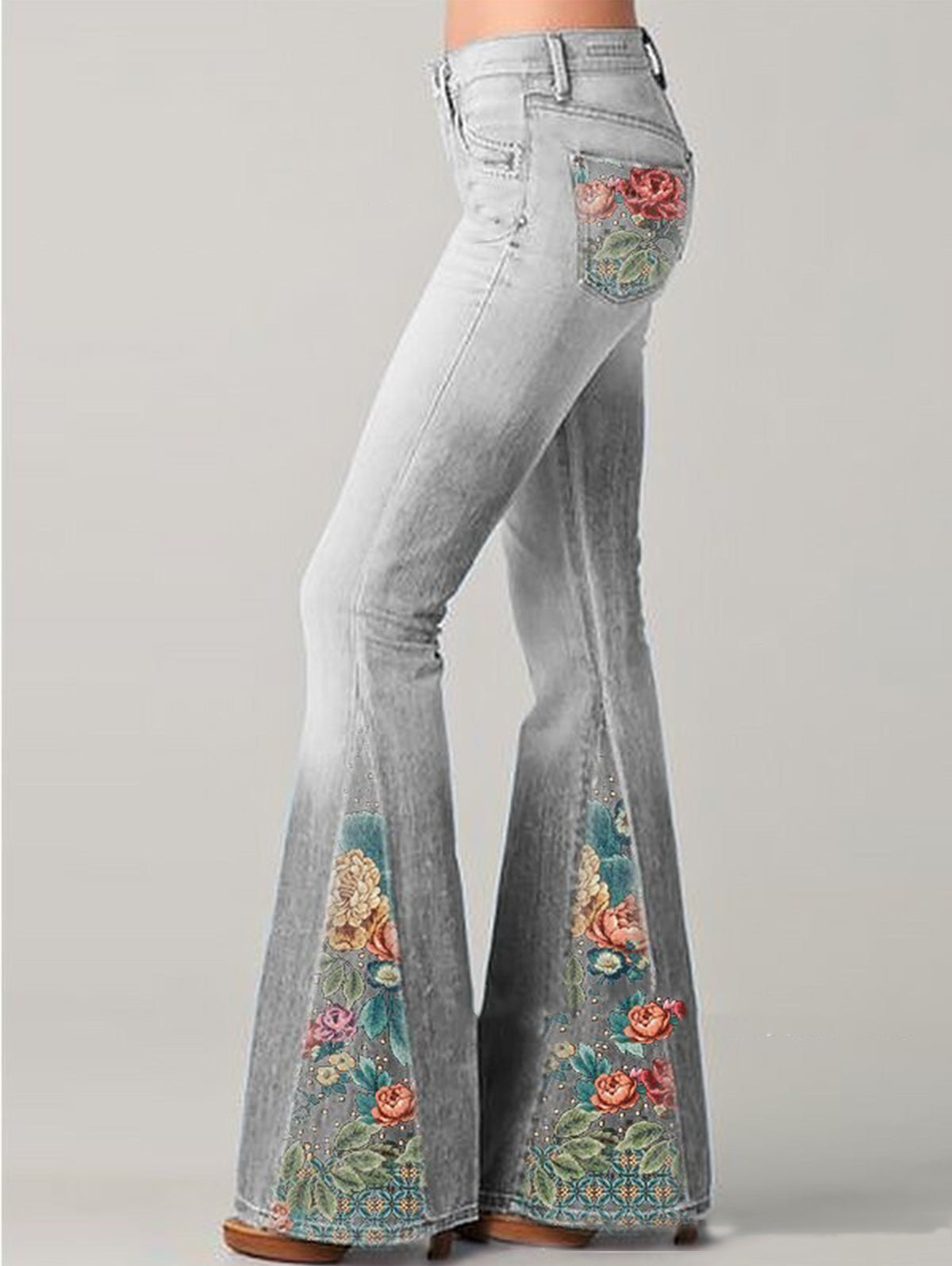 Women's high rise light wash bootcut jeans with colorful floral embroidery, boho denim style