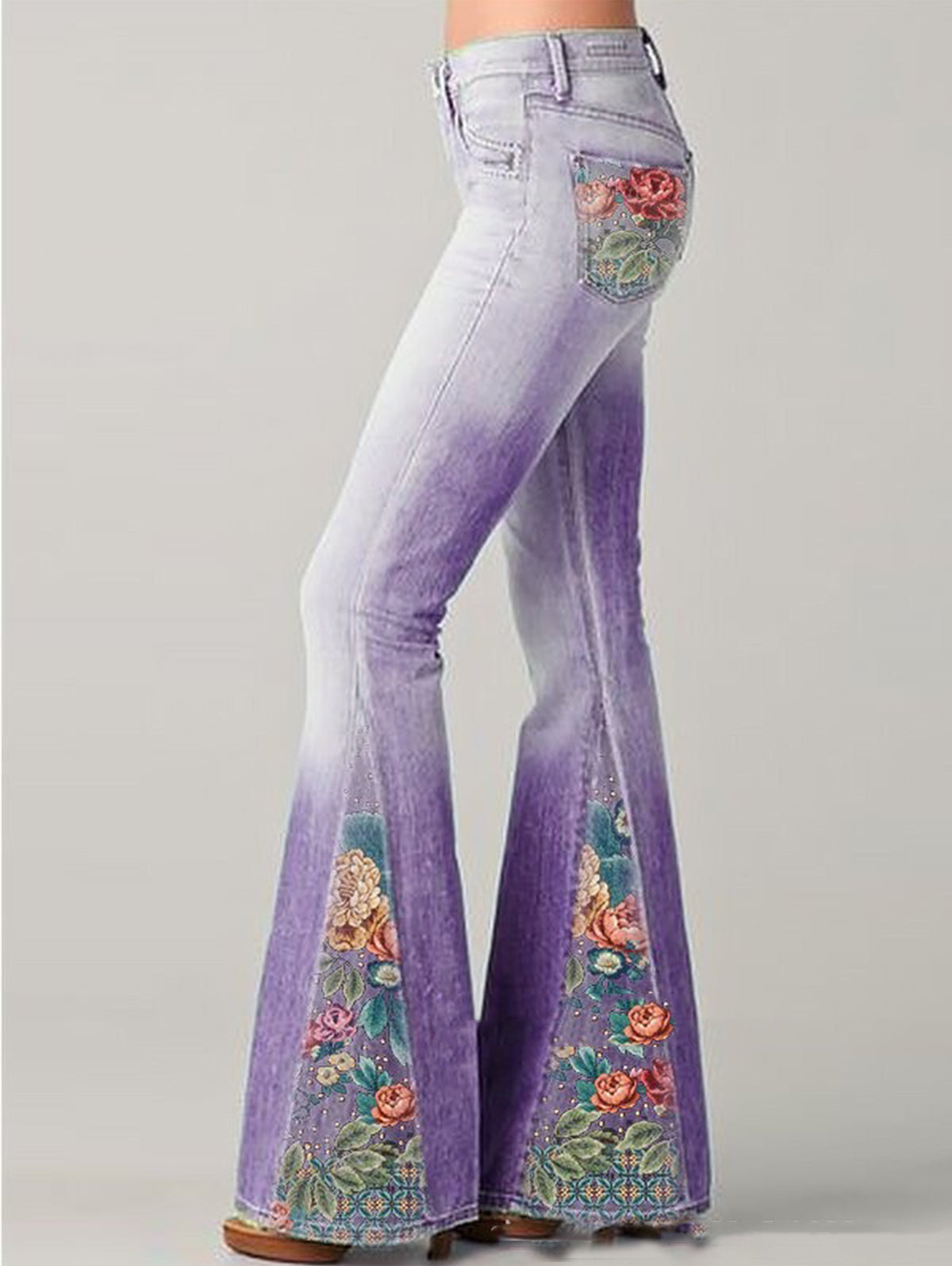 Women's high rise light wash bootcut jeans with colorful floral embroidery boho denim style