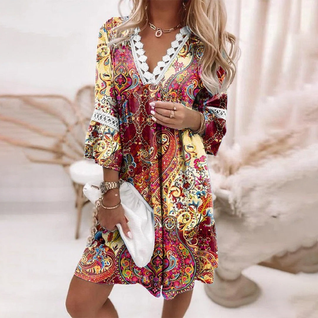 Floral A-line summer dress with lace trim, scalloped V-neck, and flowy bell sleeves in lightweight fabric