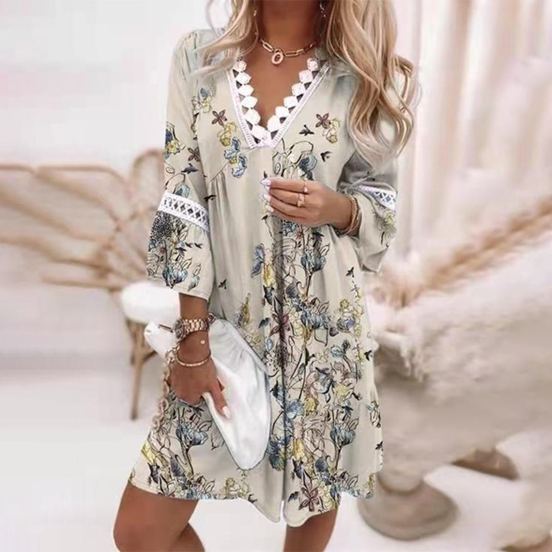 Floral A-line summer dress with lace trim, scalloped V-neck, and bell sleeves in lightweight fabric