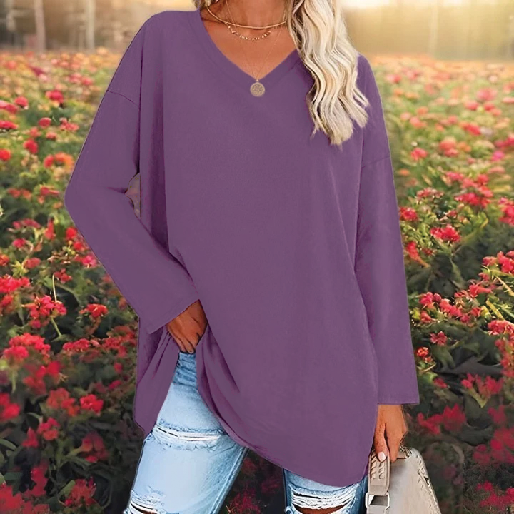 Women's relaxed draped v-neck tunic top with dropped shoulders for effortless layering