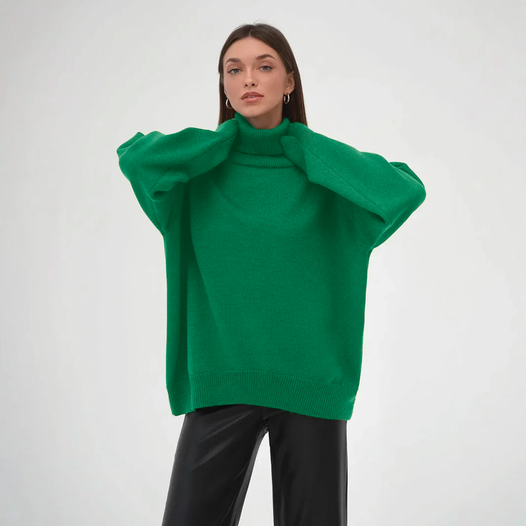 Women's oversized ivory knit turtleneck sweater with ribbed detail and relaxed cozy silhouette