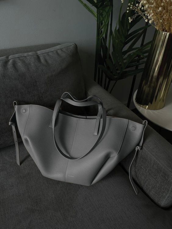 Oversized structured leather tote bag trapezoid silhouette grain-textured open-top everyday carryall