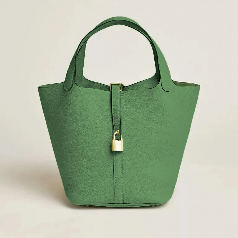 Structured grain leather tote bag for women, elegant silhouette with secure strap closure, all-season carry