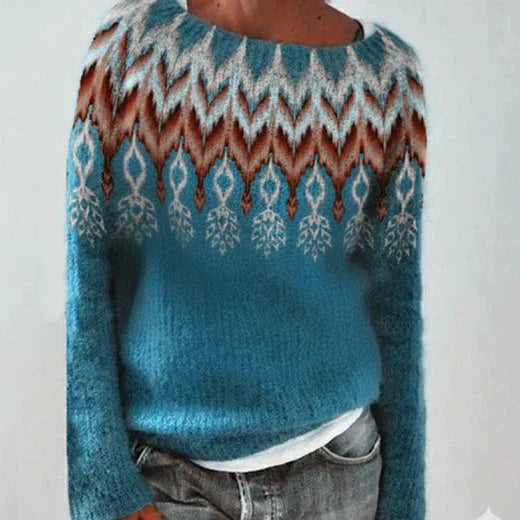 Women's winter knit sweater with bold color transitions, cozy patterned design, and vibrant upper motif