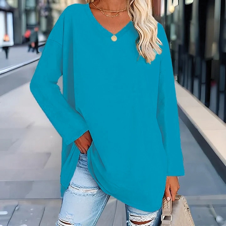 Women's relaxed draped v-neck tunic top with dropped shoulders for effortless layering