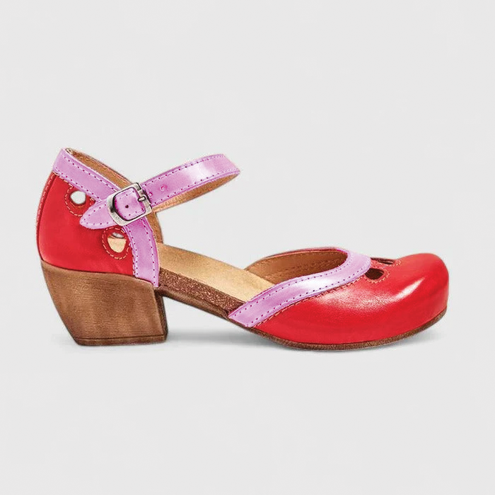 Women's black Mary Jane shoes with rounded toe, secure buckle strap, and elegant cutout details