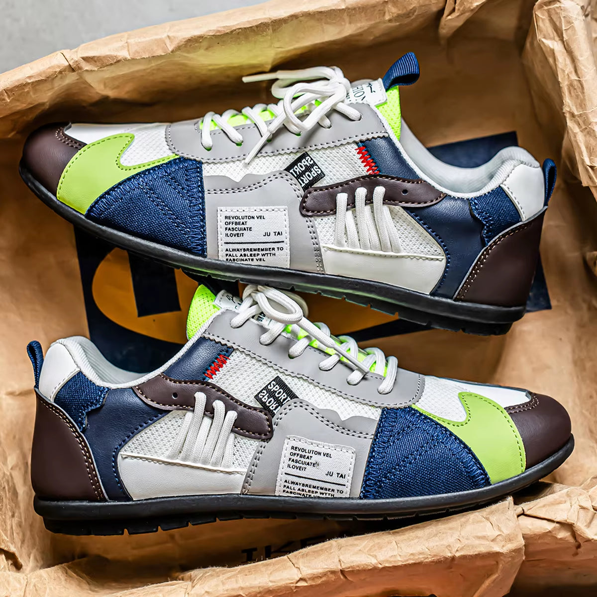 Bold multi-panel streetwear trainer sneakers with contrast colorways and reinforced stitching for all-day comfort