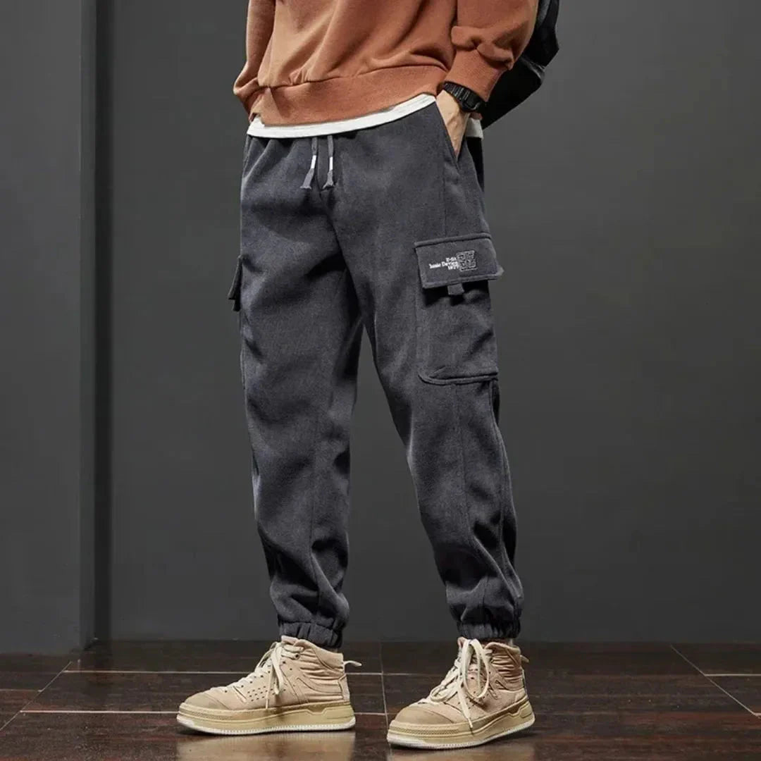 Black thermal fleece-lined tactical cargo pants streetwear style dual cargo pockets ribbed cuffs