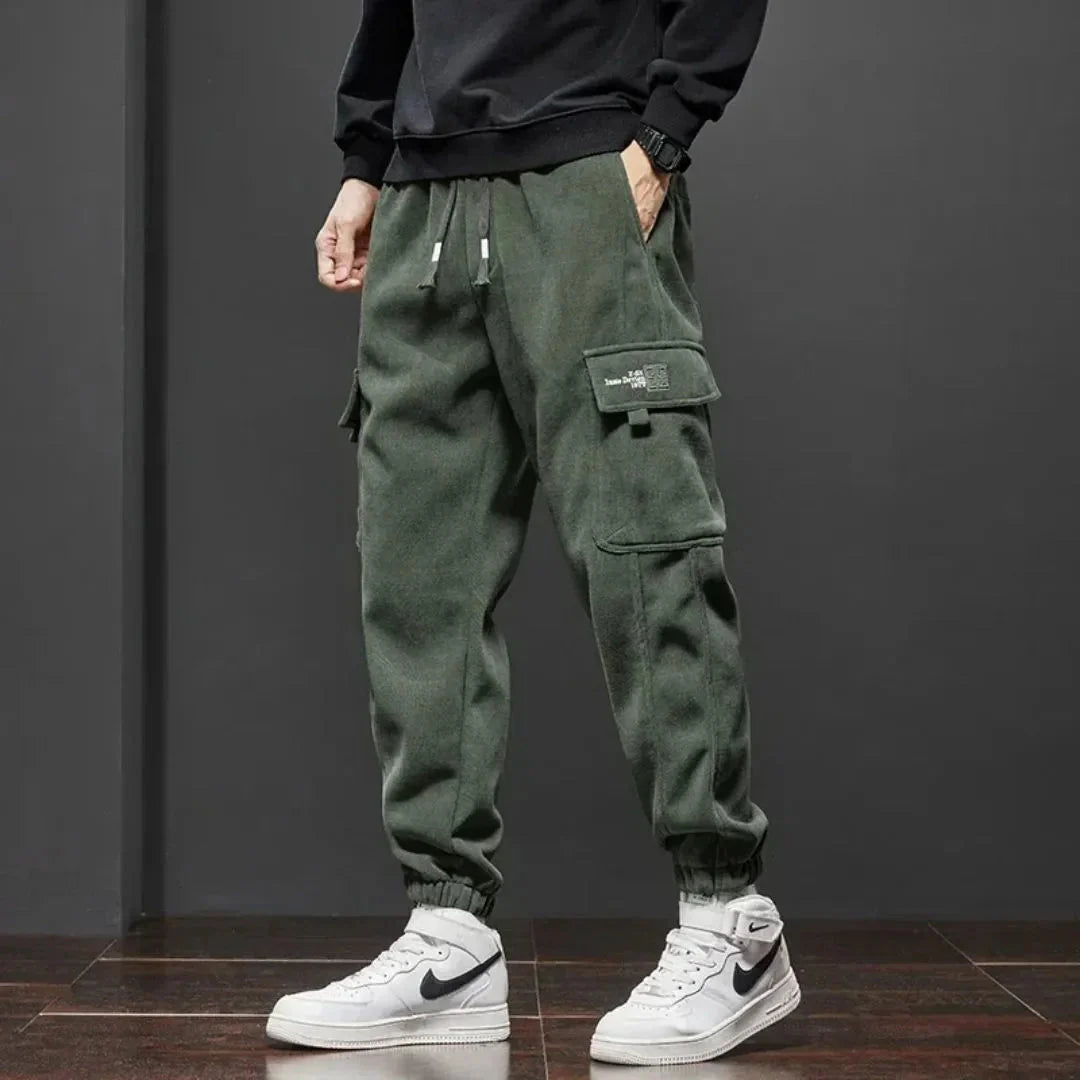 Black thermal fleece-lined tactical cargo pants streetwear cut with dual cargo pockets and ribbed cuffs