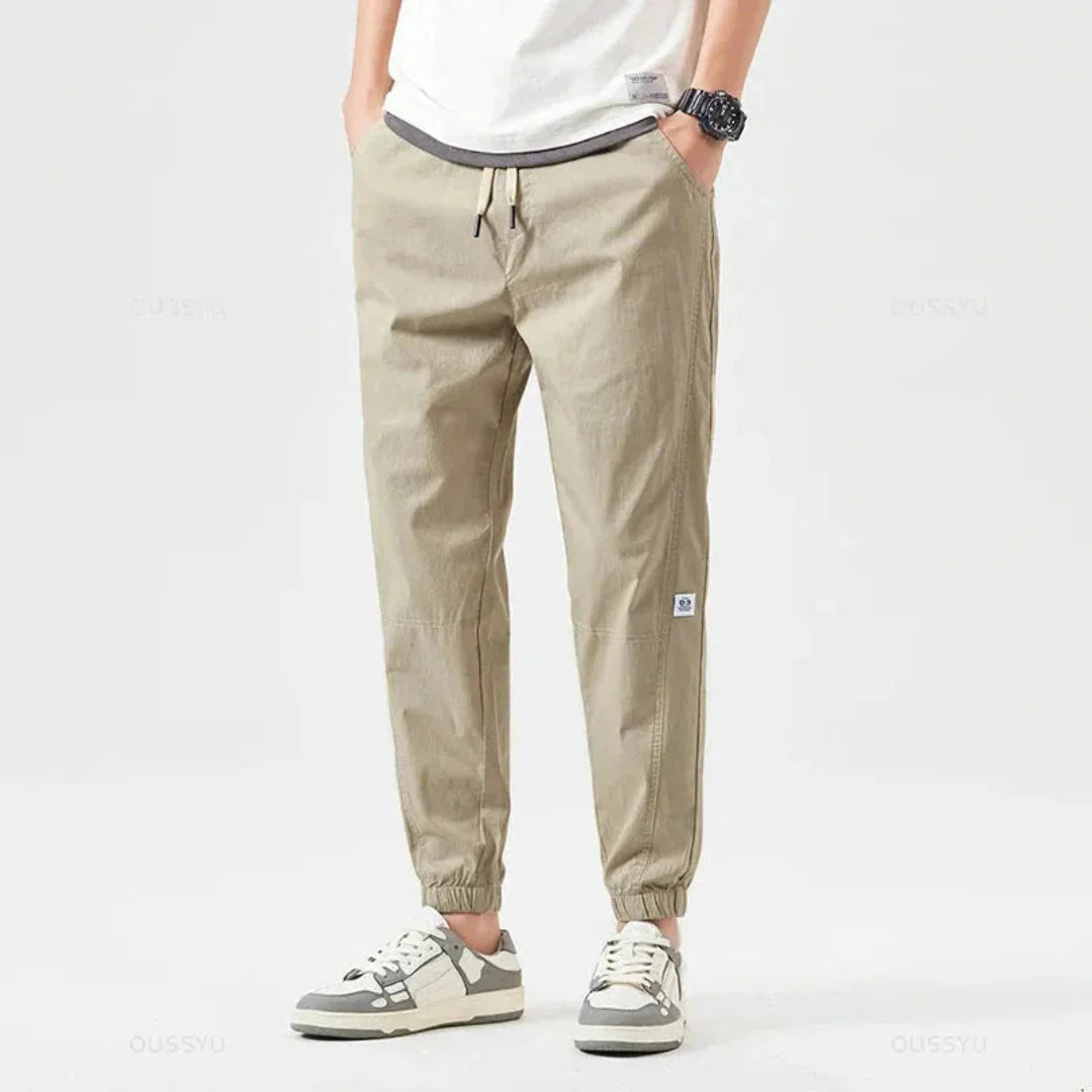 Khaki rugged cargo jogger pants with reinforced stitching and weather-resistant utility pockets