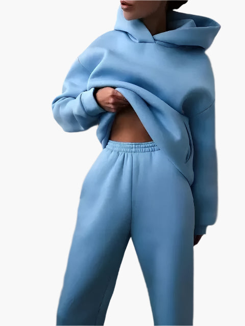 Women's cozy hoodie and jogger set in warm tones, relaxed-fit two-piece winter loungewear