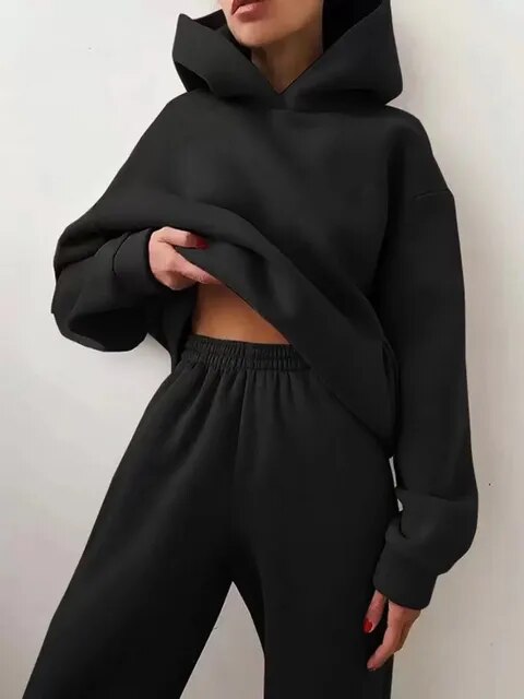Women's cozy two-piece hoodie and sweatpants set in plush fabric for winter loungewear