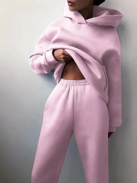 Women's cozy two-piece hoodie and sweatpants set in plush fabric for winter loungewear