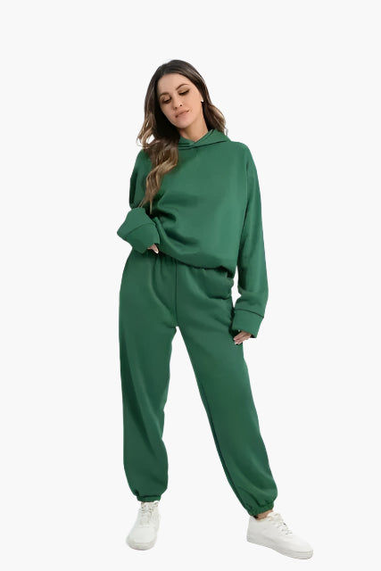 Women's cozy hoodie and jogger set in soft winter loungewear style with matching two-piece design
