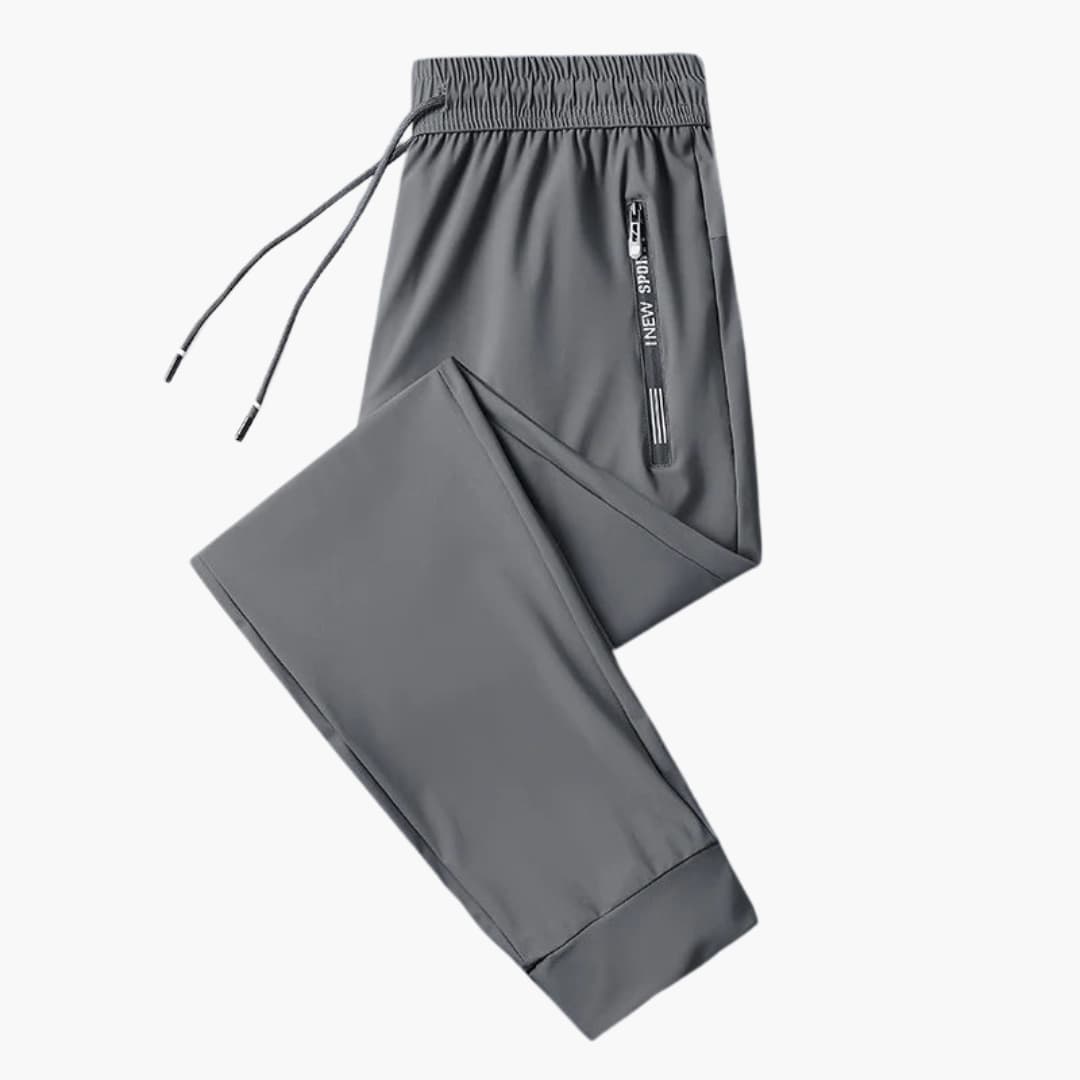 Men's gray athletic jogger pants with elastic drawstring waist and secure zipper pockets