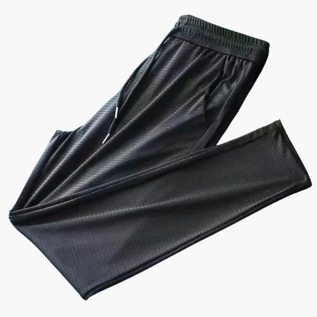Men's gray athletic jogger pants with elastic drawstring waist and secure zipper pockets for active wear