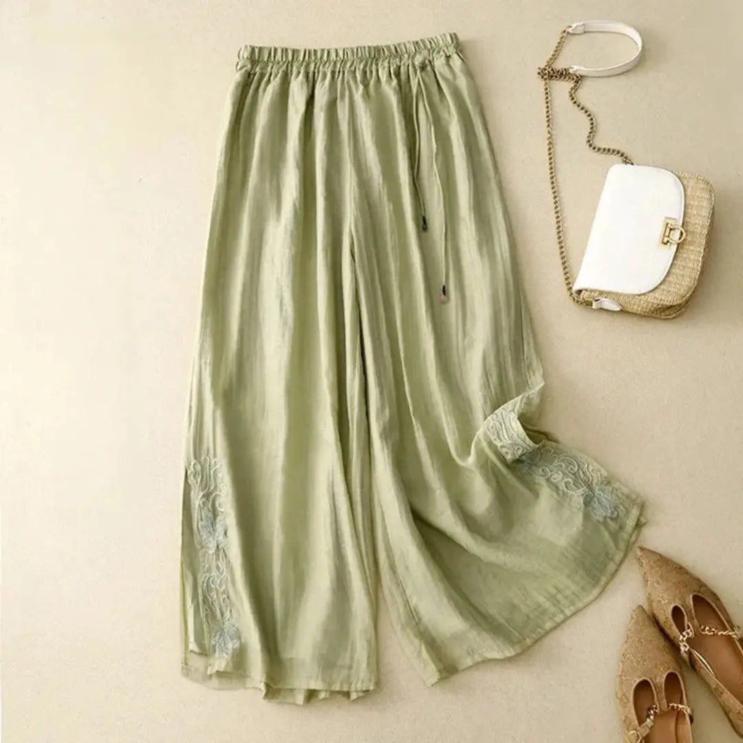 Women's white wide leg linen pants with tonal embroidery, elastic waist, breezy flowy silhouette