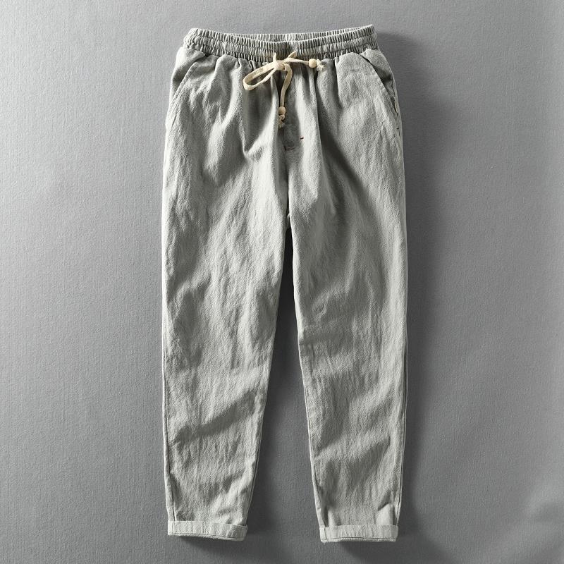 Men's taupe linen blend tapered trousers with elastic waistband, ankle-length relaxed tailored fit