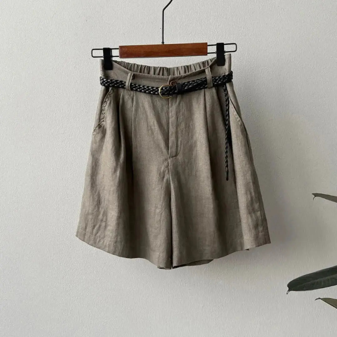 Women's high-waisted linen shorts with braided belt, relaxed pleated fit, natural beige tone