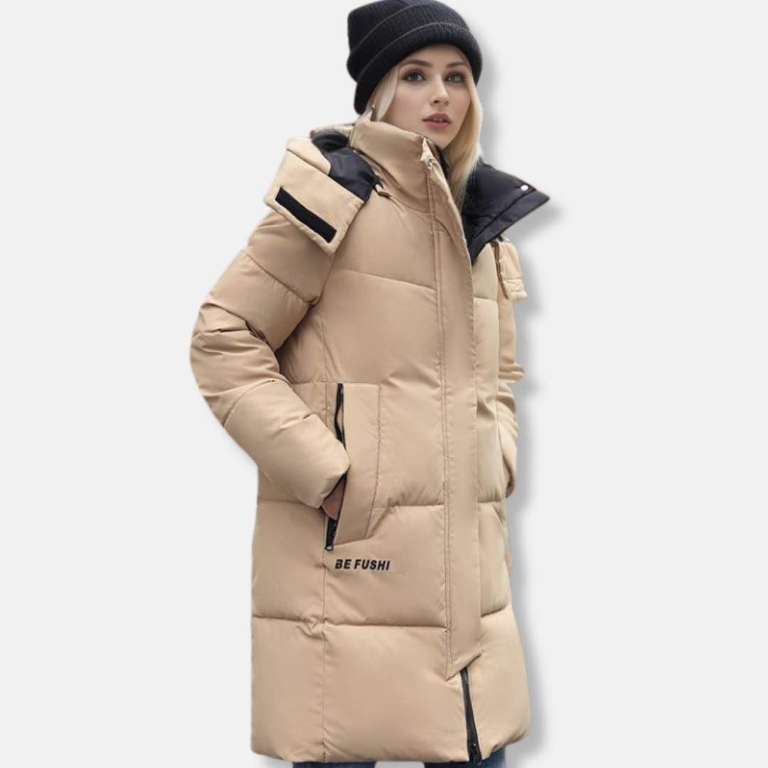 Women's hooded mid-thigh puffer coat in cozy quilted silhouette with high collar for winter warmth