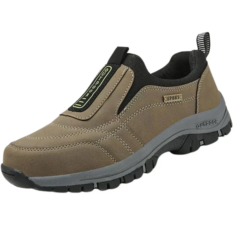 Slip-on trail shoes in neutral tones with rugged tread outsole and cushioned midsole for outdoor use