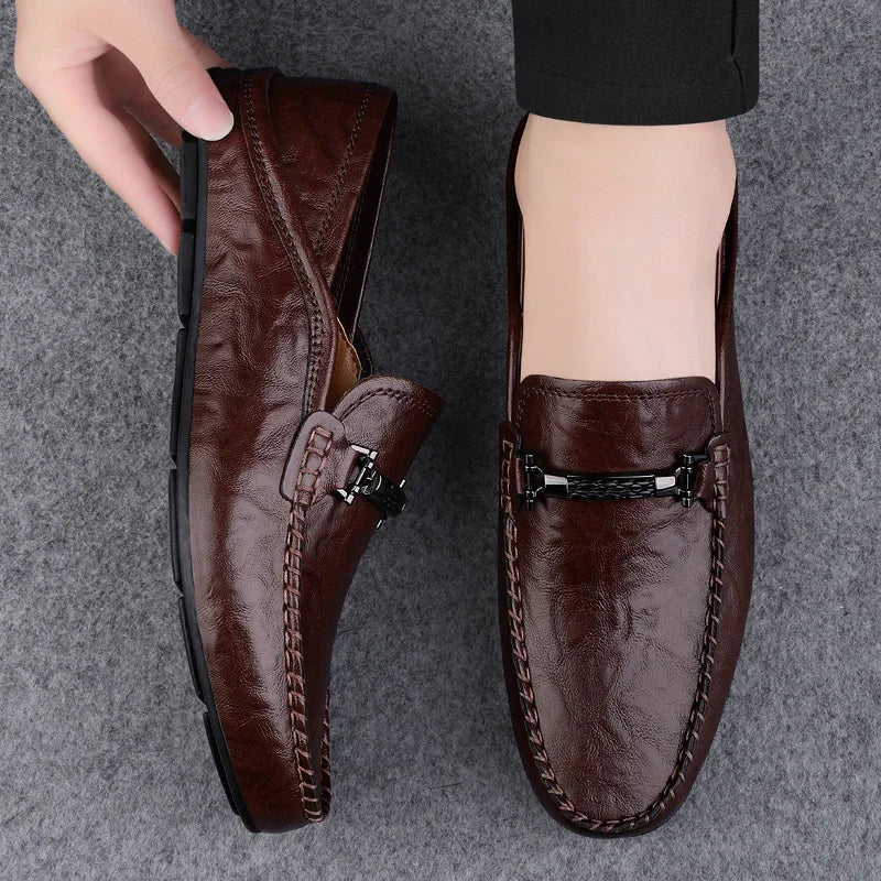 Men's brown leather loafers slip-on style with cushioned grid sole and handstitched details