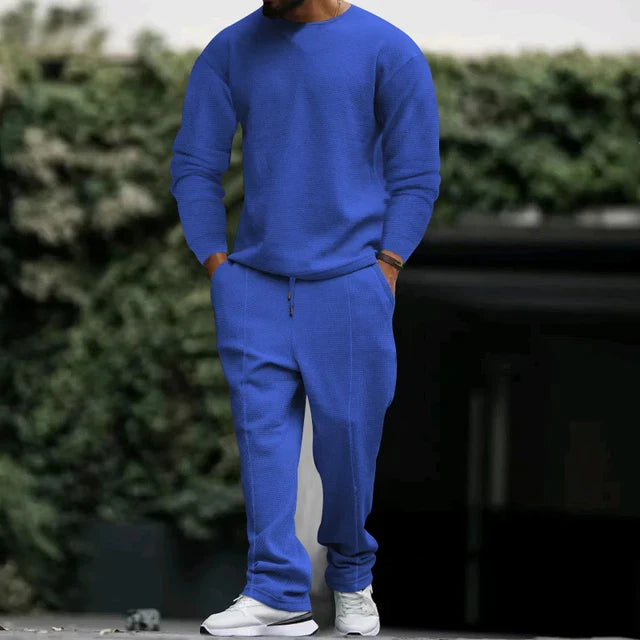 Men's classic navy blue tracksuit set with pullover and matching pants featuring clean minimalist design