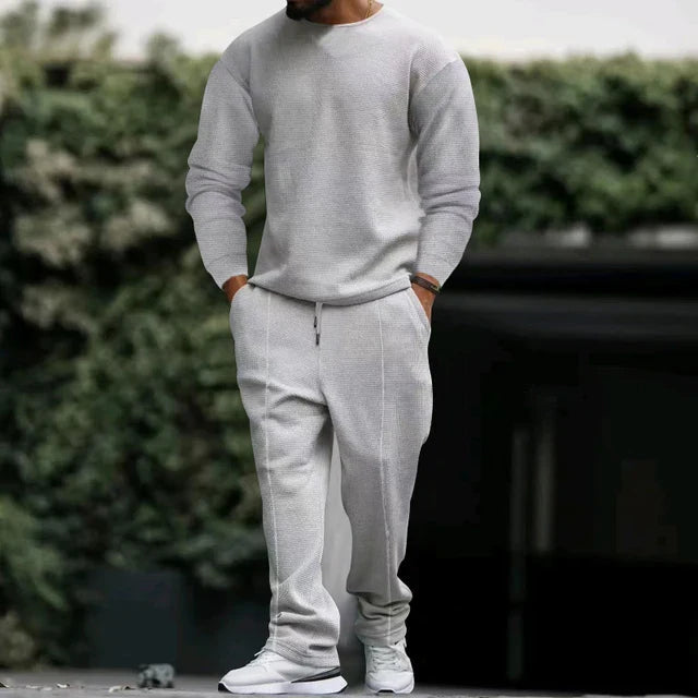 Men's classic navy tracksuit set with pullover and matching pants, slim-fit polished athletic style