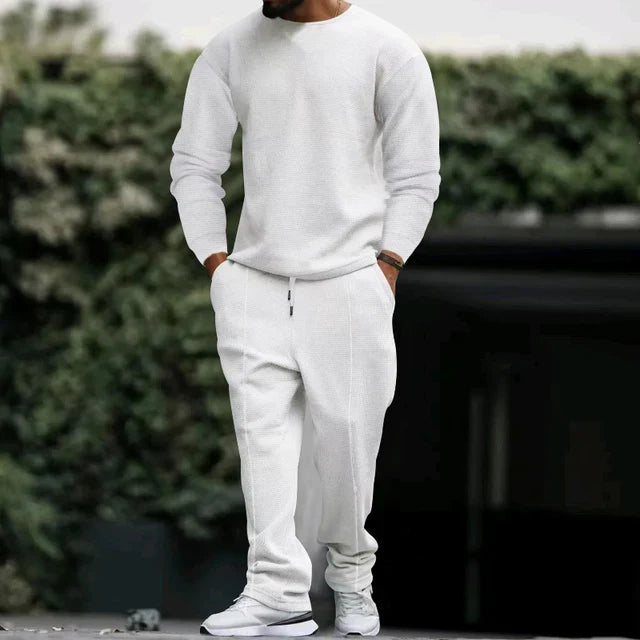 Men's classic tracksuit set in neutral tone, pullover and pants with refined polished design for all-day wear