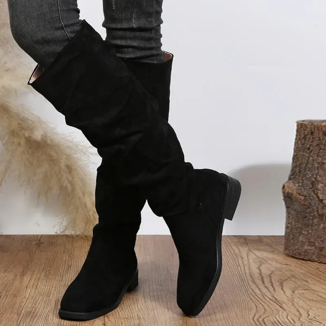 Women's black knee-high boots with supportive thick block heel and sleek fitted silhouette