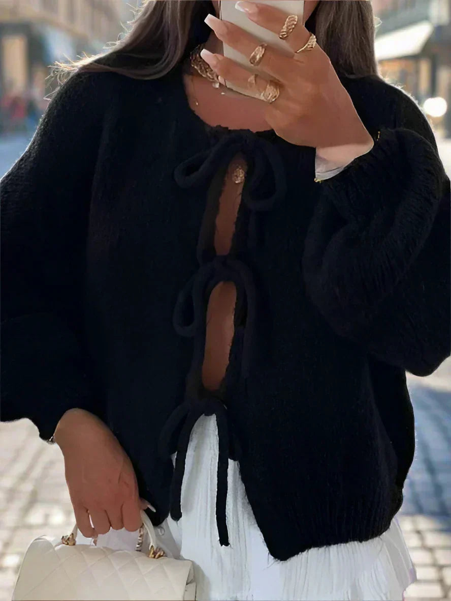 Women's chunky knit oversized cardigan with cozy texture and knotted front detail for winter