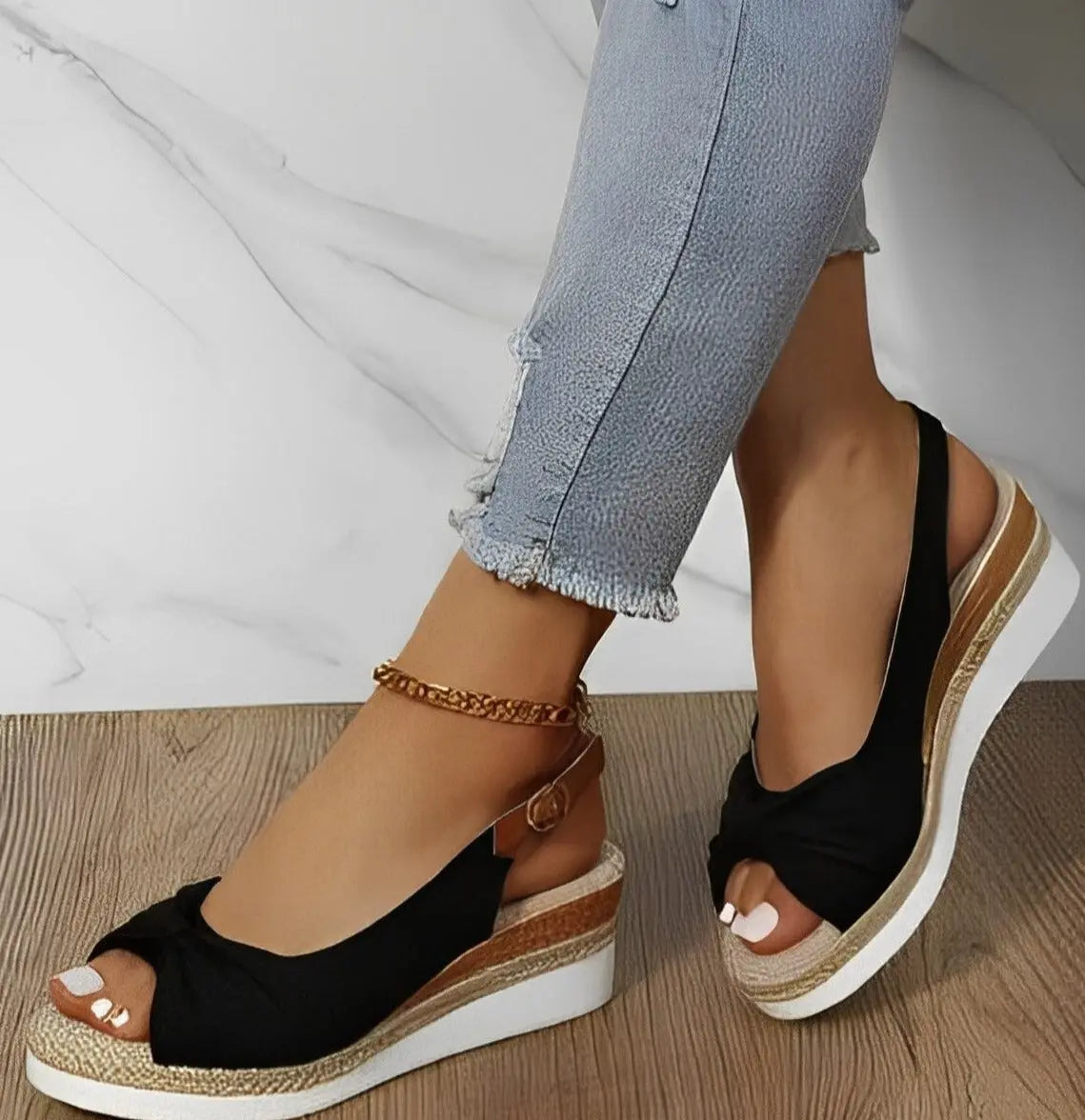 Women's espadrille wedge sandals with chic knot detail, cushioned sole, and secure slingback for summer