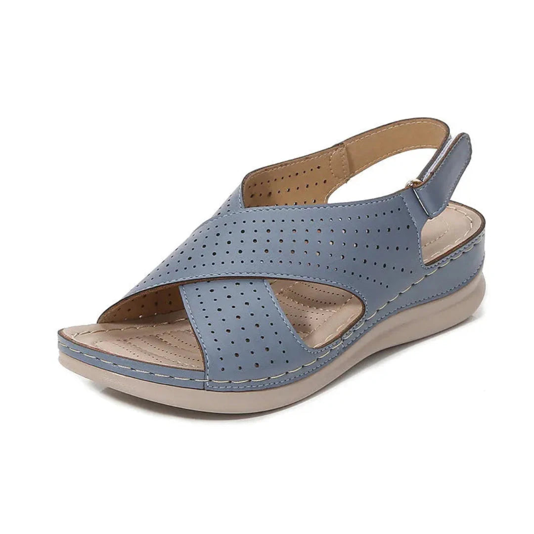 Women's black faux leather criss-cross strap sandal with breathable perforated upper for all-day comfort