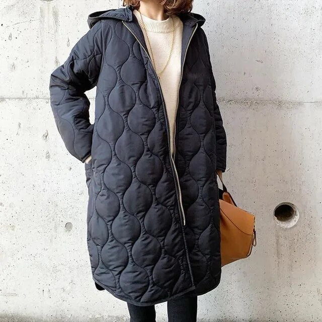 Women's relaxed fit quilted winter coat in neutral tone, effortless warmth with trendy loose silhouette