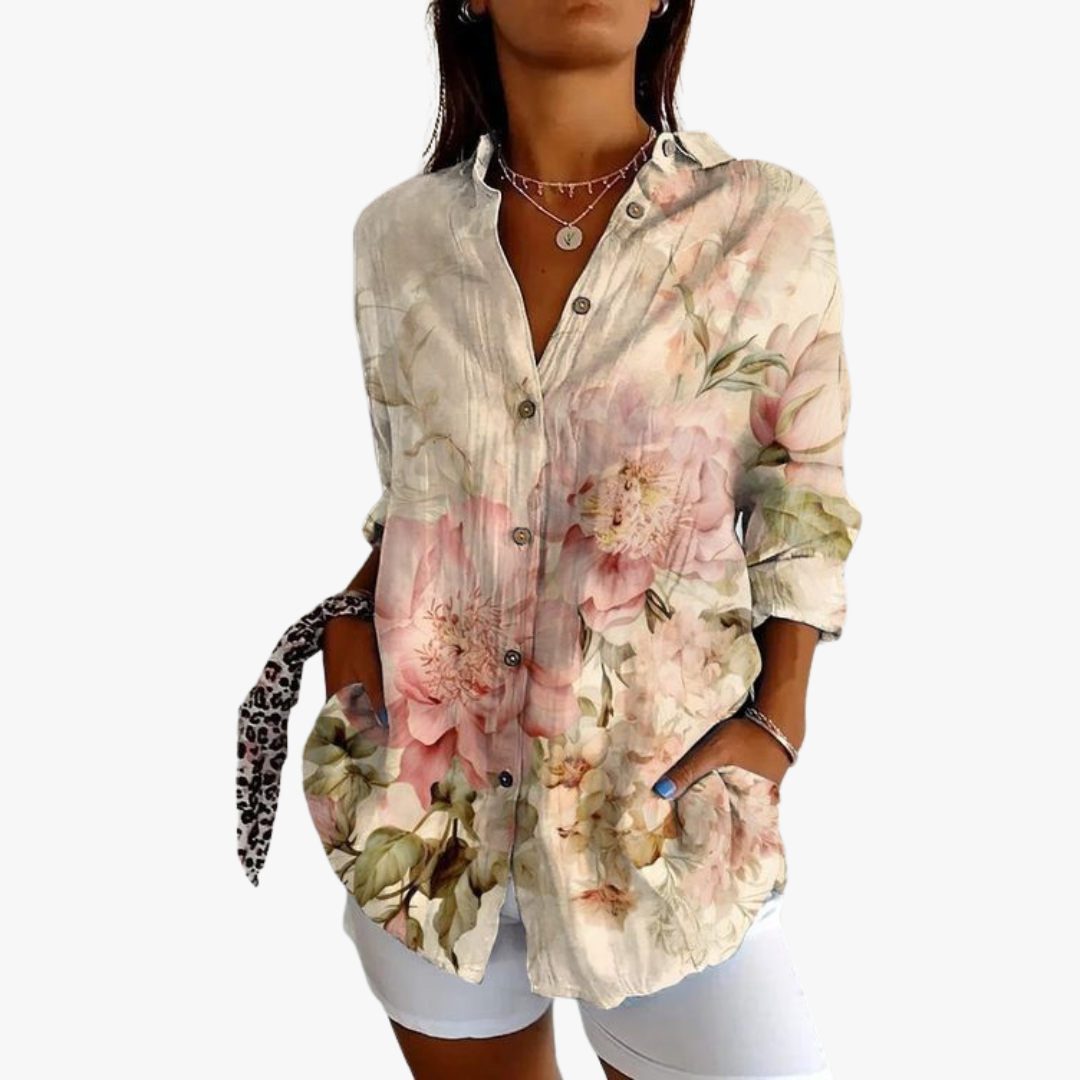 Women's white linen blouse with handcrafted embroidery, relaxed fit, timeless artisanal elegance