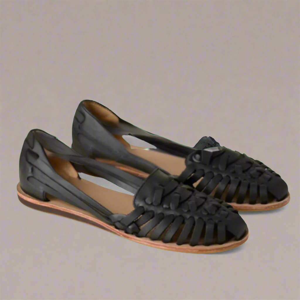 Women's flat summer sandals with adjustable straps, cushioned insole, and lightweight synthetic leather upper
