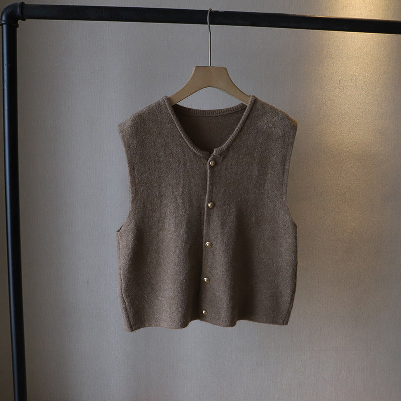 Ivory silky-soft knit vest with elegant button closure and graceful draped silhouette
